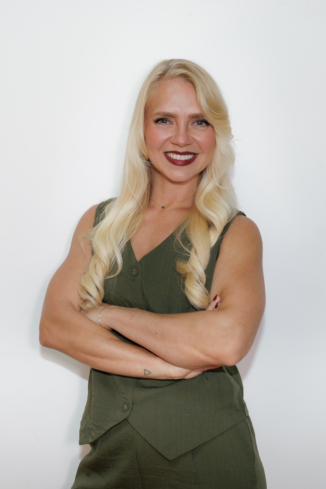 Shaina, founder of The Veracity Co., arms crossed
